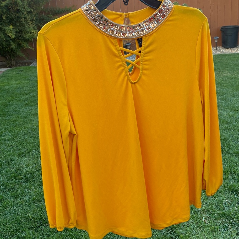 Women’s blouse with studded neck.